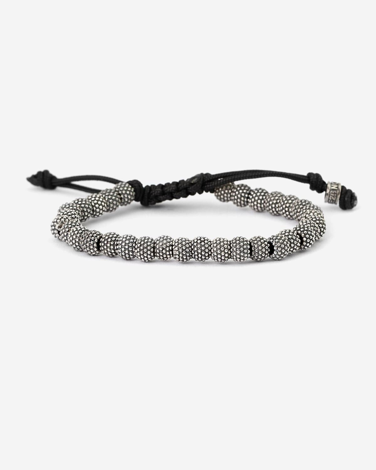 BRACELET CORDE ÉLÉMENTS TONDES À PICOTS