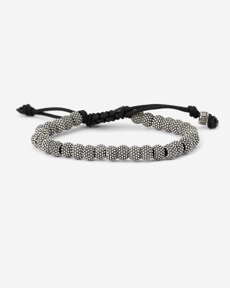 BRACELET CORDE ÉLÉMENTS TONDES À PICOTS