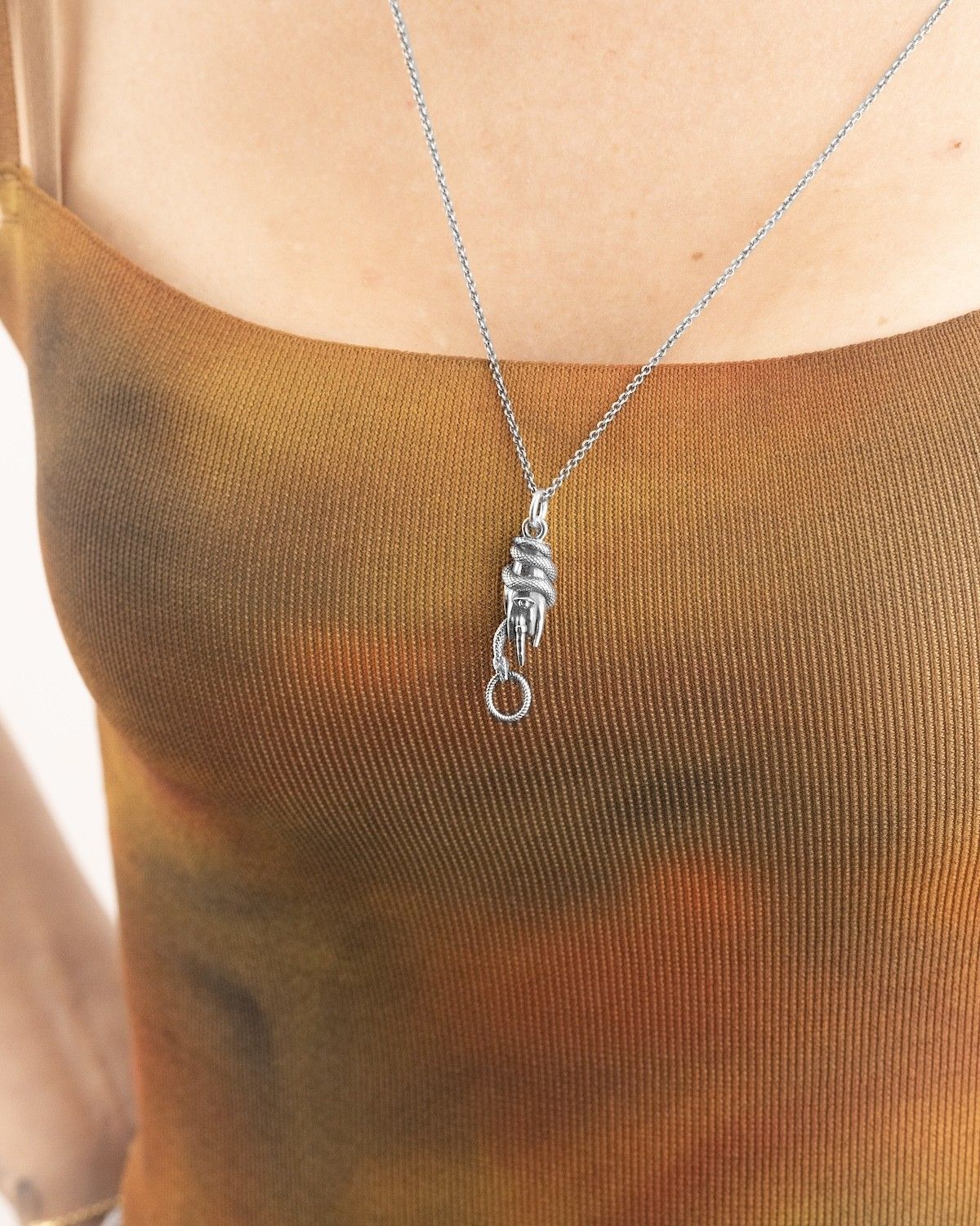 HAND WITH SNAKE PENDANT
